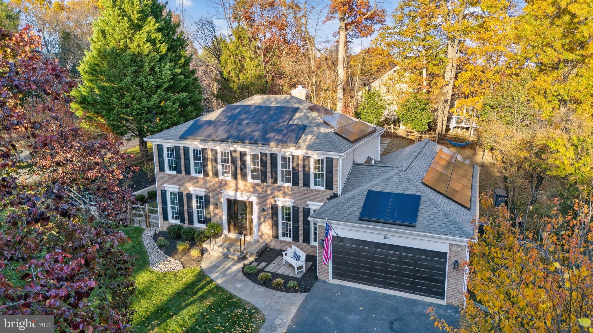 12100 Triple Crown Road North Potomac, MD 20878 - Photo 5 of 66 a front view of a house with a yard