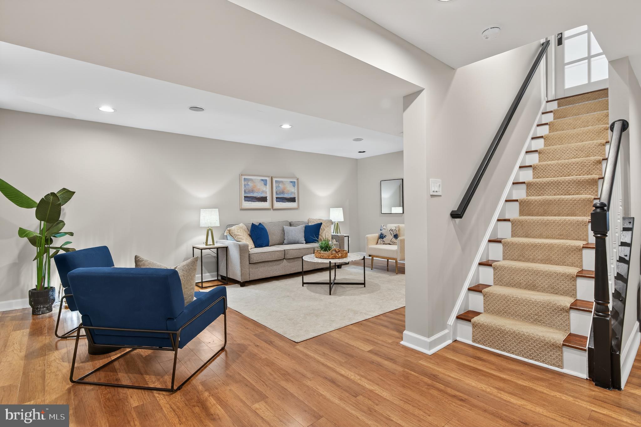 12100 Triple Crown Road North Potomac, MD 20878 - Photo 51 of 66 a living room with furniture and a wooden floor