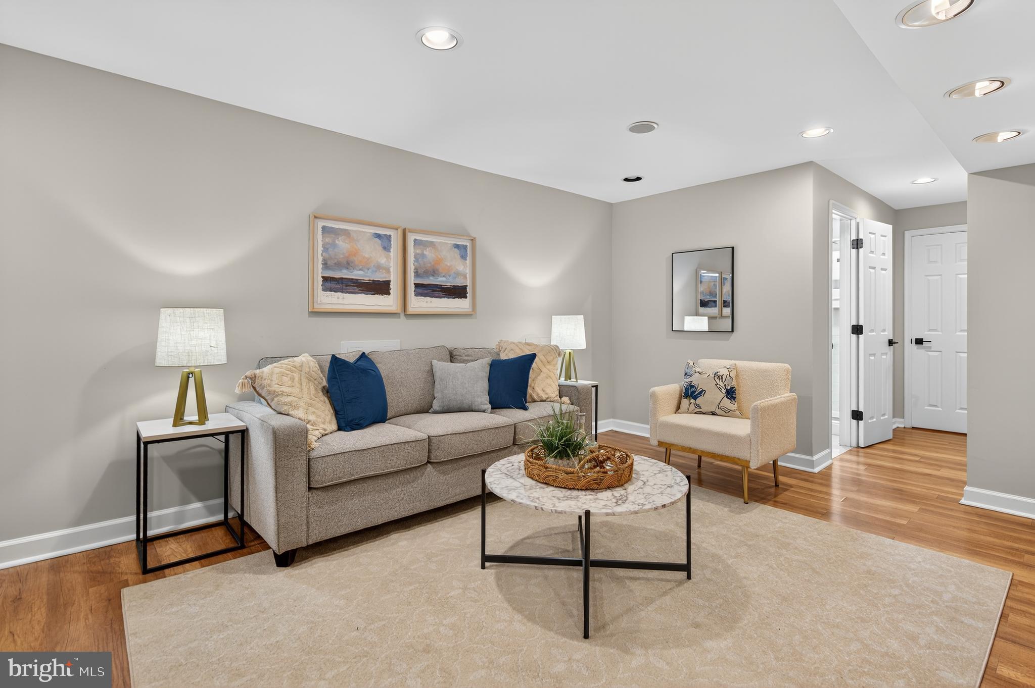 12100 Triple Crown Road North Potomac, MD 20878 - Photo 52 of 66 a living room with furniture and a wooden floor