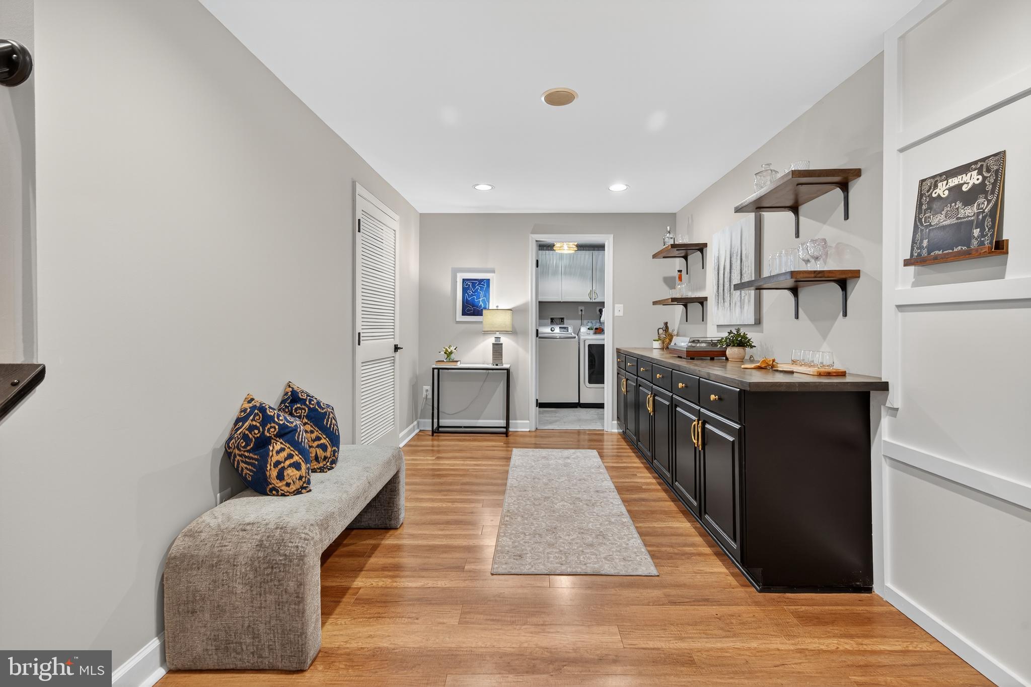 12100 Triple Crown Road North Potomac, MD 20878 - Photo 57 of 66 a large white kitchen with stainless steel appliances kitchen island granite countertop a refrigerator oven a sink dishwasher and white cabinets next to a window