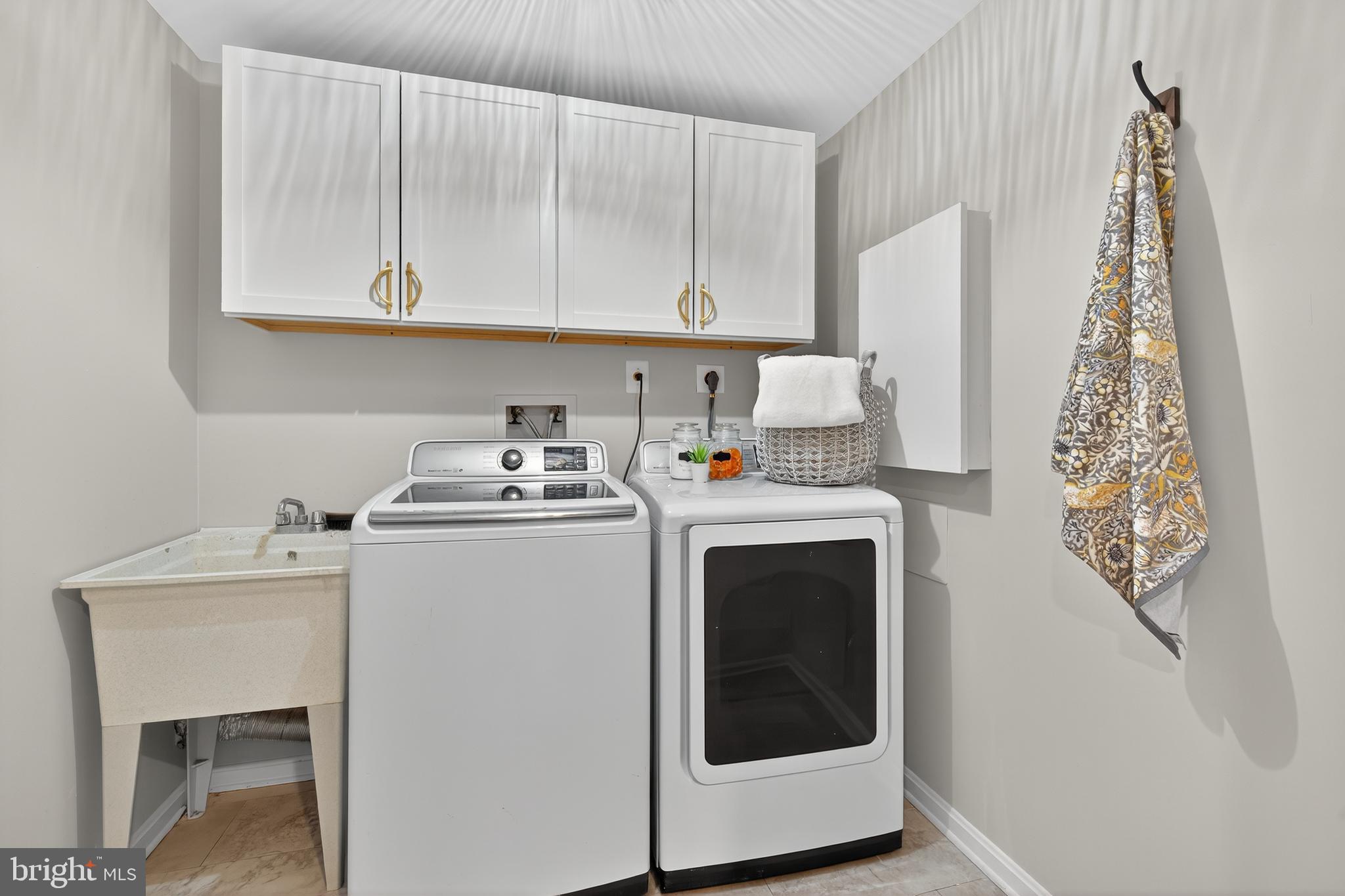 12100 Triple Crown Road North Potomac, MD 20878 - Photo 60 of 66 a utility room with dryer and washer