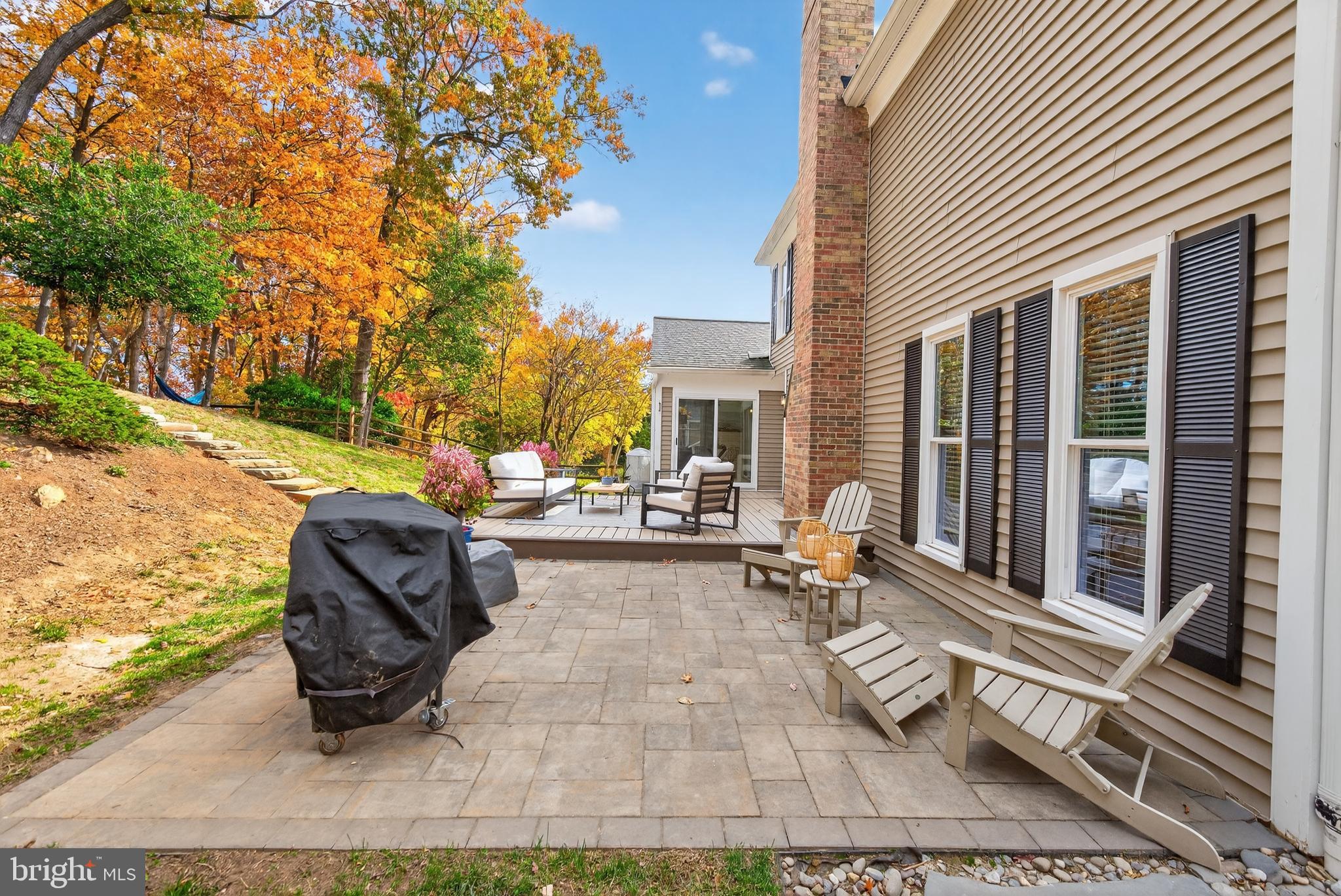 12100 Triple Crown Road North Potomac, MD 20878 - Photo 63 of 66 a view of a patio with table and chairs and floor to ceiling window