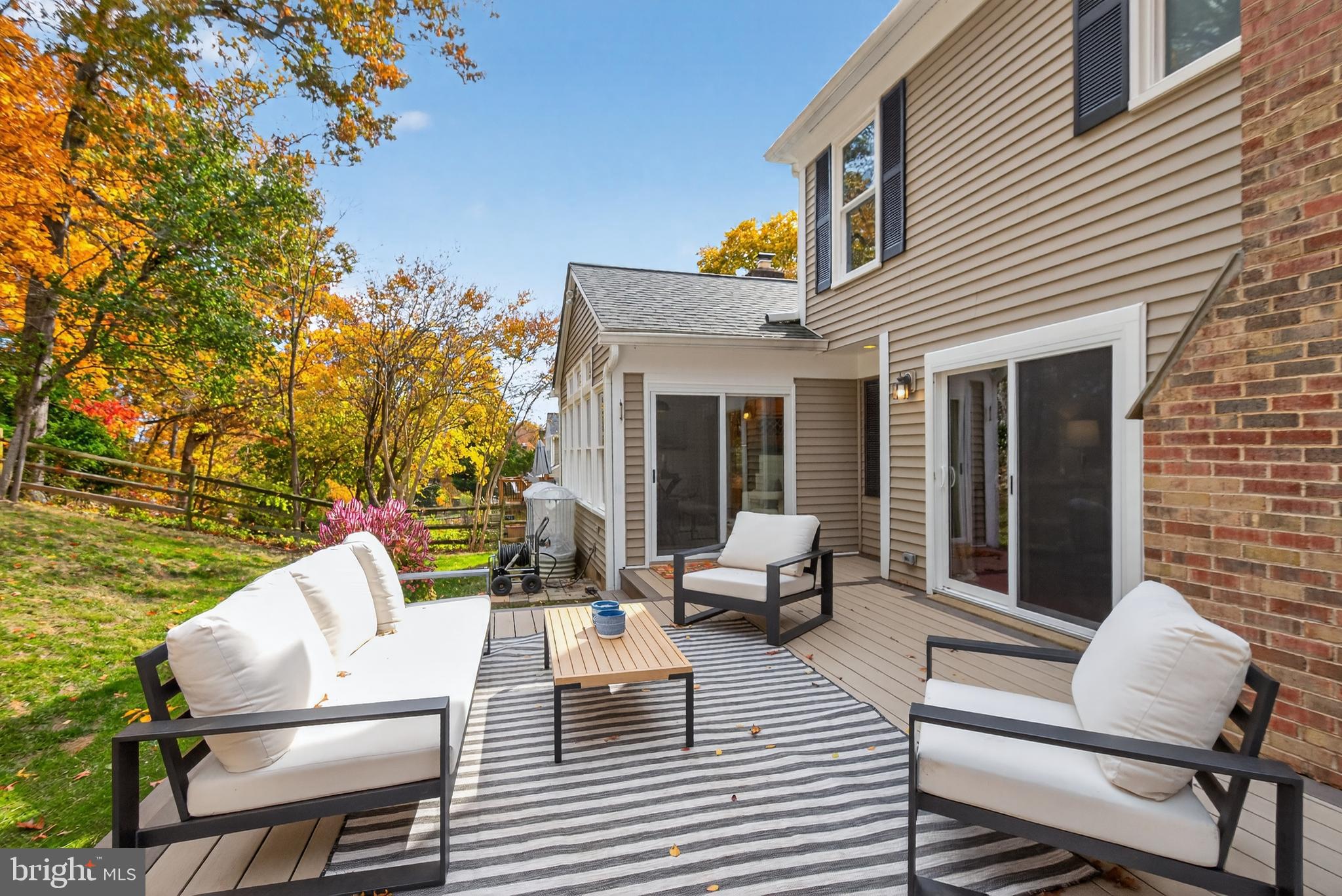12100 Triple Crown Road North Potomac, MD 20878 - Photo 64 of 66 a view of a patio with couches table and chairs and potted plants