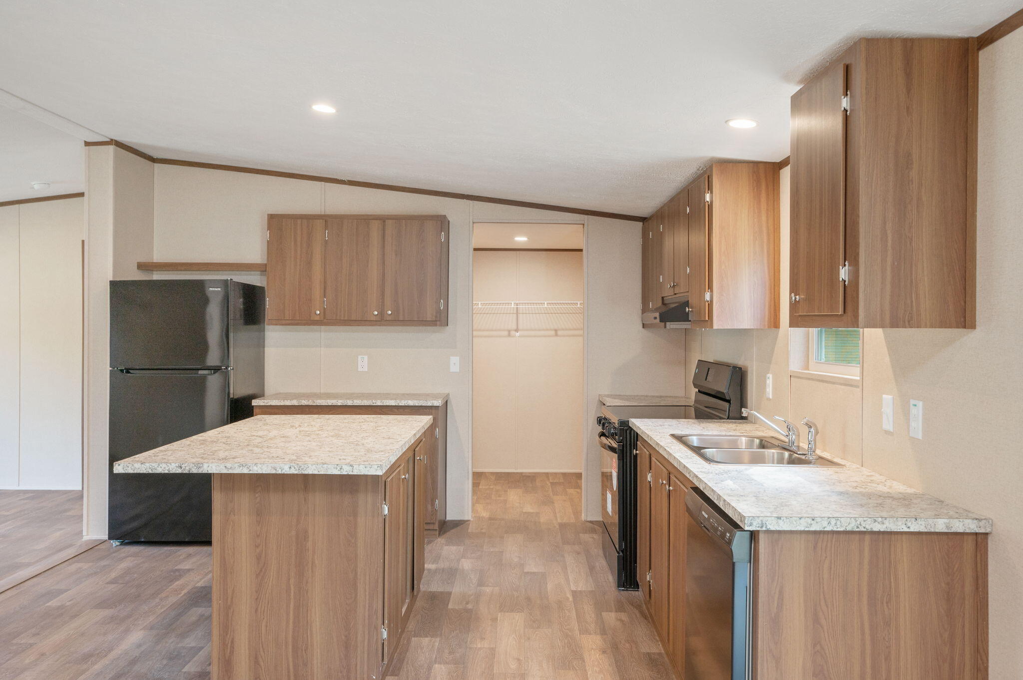 8255 Punjob Road Milton, FL 32583 - Photo 12 of 37 a kitchen with a sink a stove a refrigerator and a cabinets