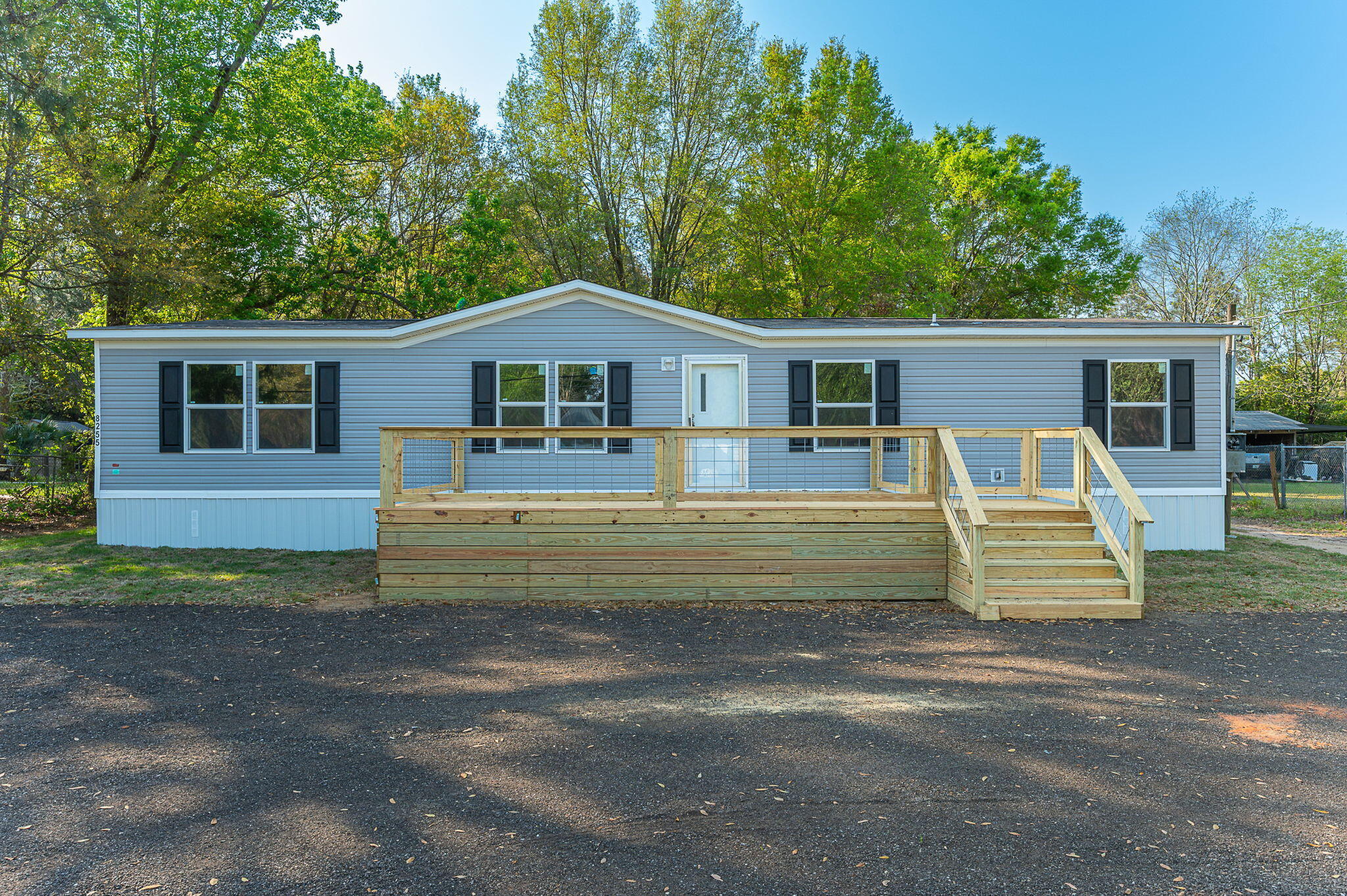 8255 Punjob Road Milton, FL 32583 - Photo 2 of 37 a front view of a house with a garden