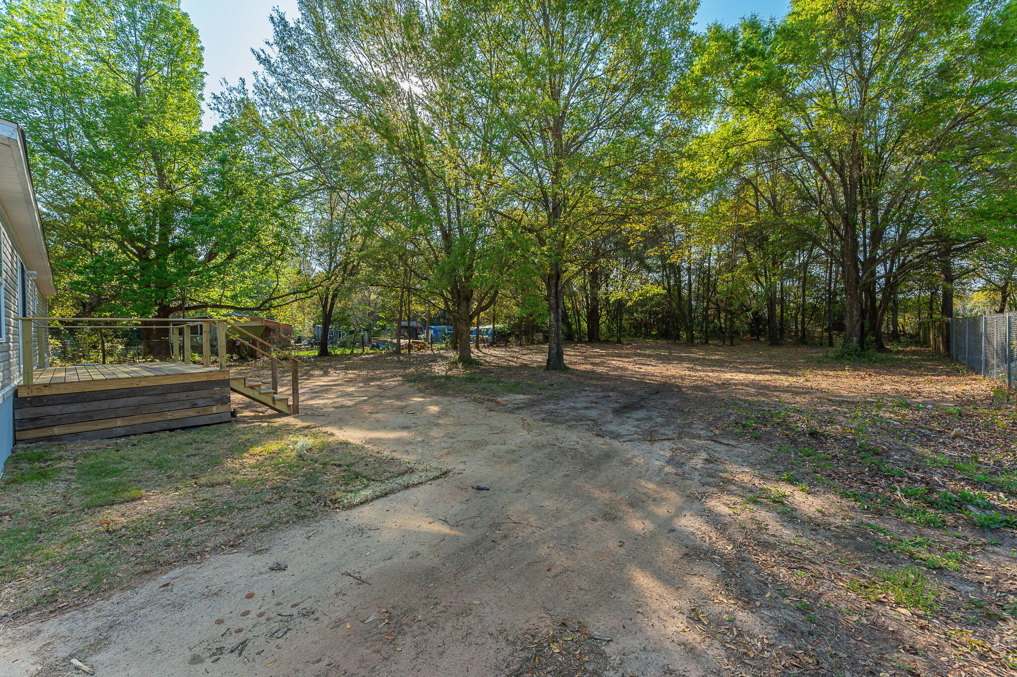 8255 Punjob Road Milton, FL 32583 - Photo 33 of 37 a view of a field with trees in the background