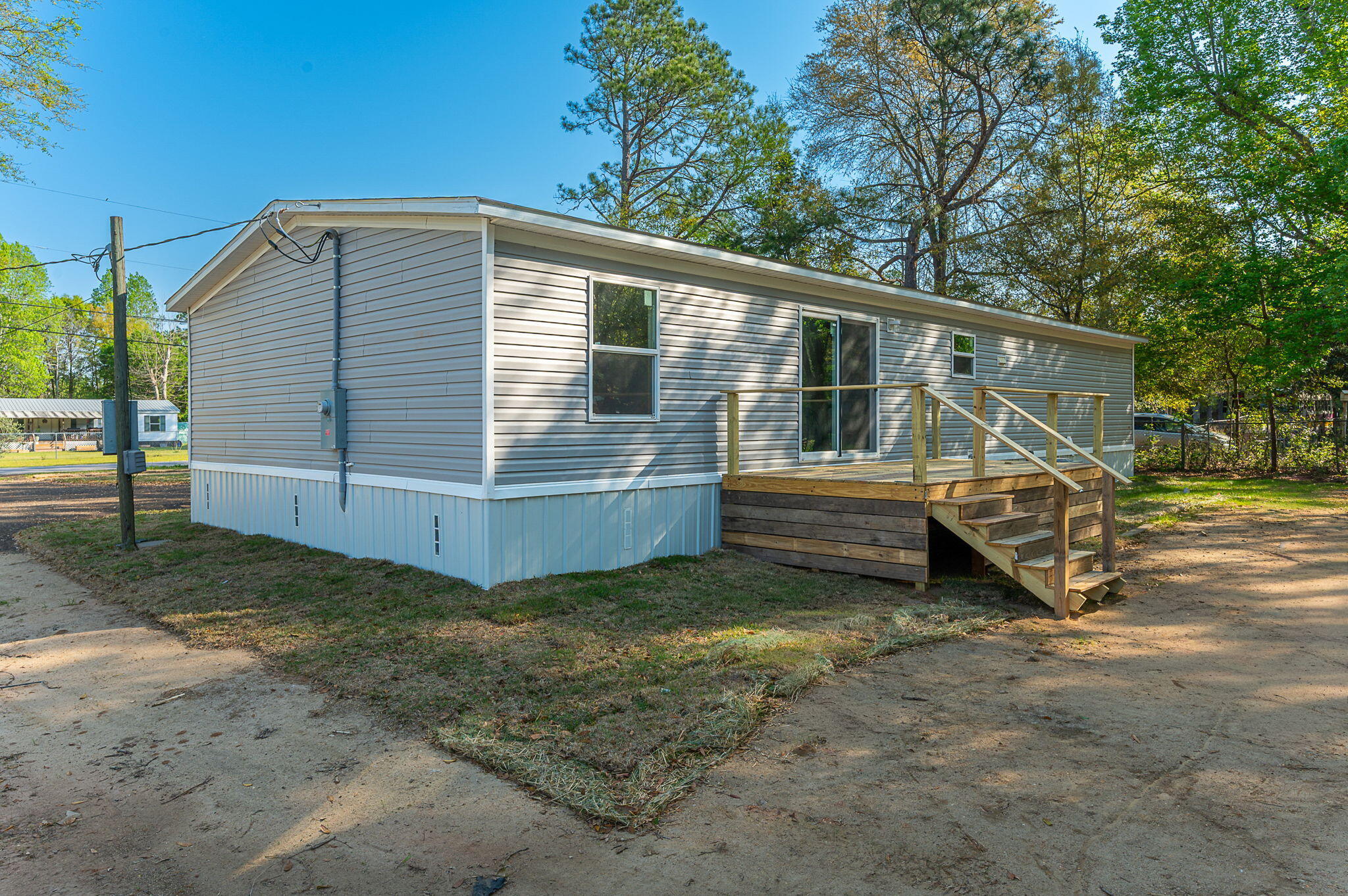 8255 Punjob Road Milton, FL 32583 - Photo 34 of 37 a view of a house with backyard and trees