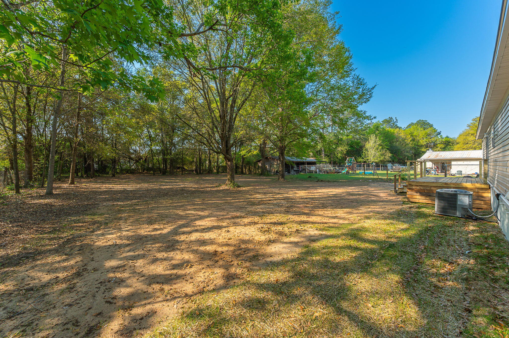 8255 Punjob Road Milton, FL 32583 - Photo 35 of 37 a view of a water fountain with large trees