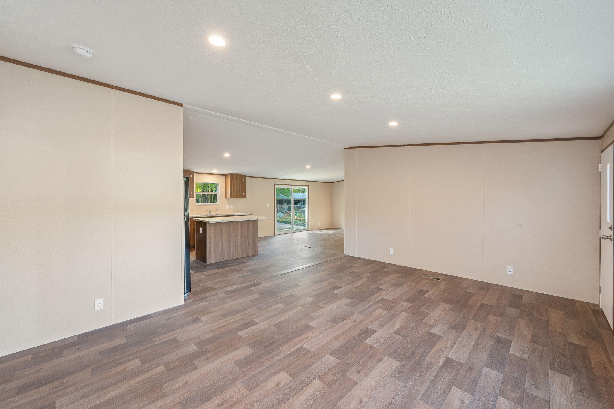 8255 Punjob Road Milton, FL 32583 - Photo 8 of 37 a view of a kitchen with a sink and a refrigerator