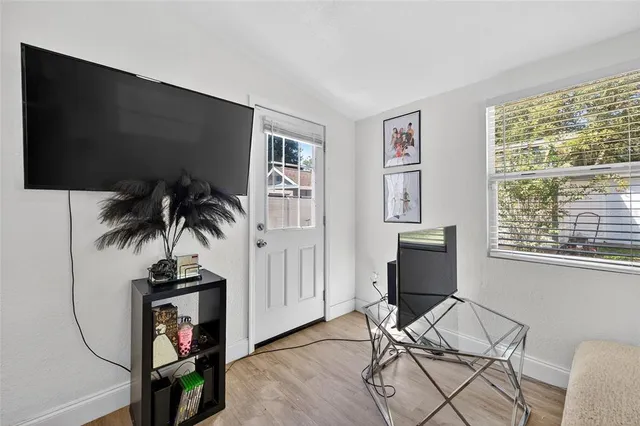 a view of a livingroom with furniture and window