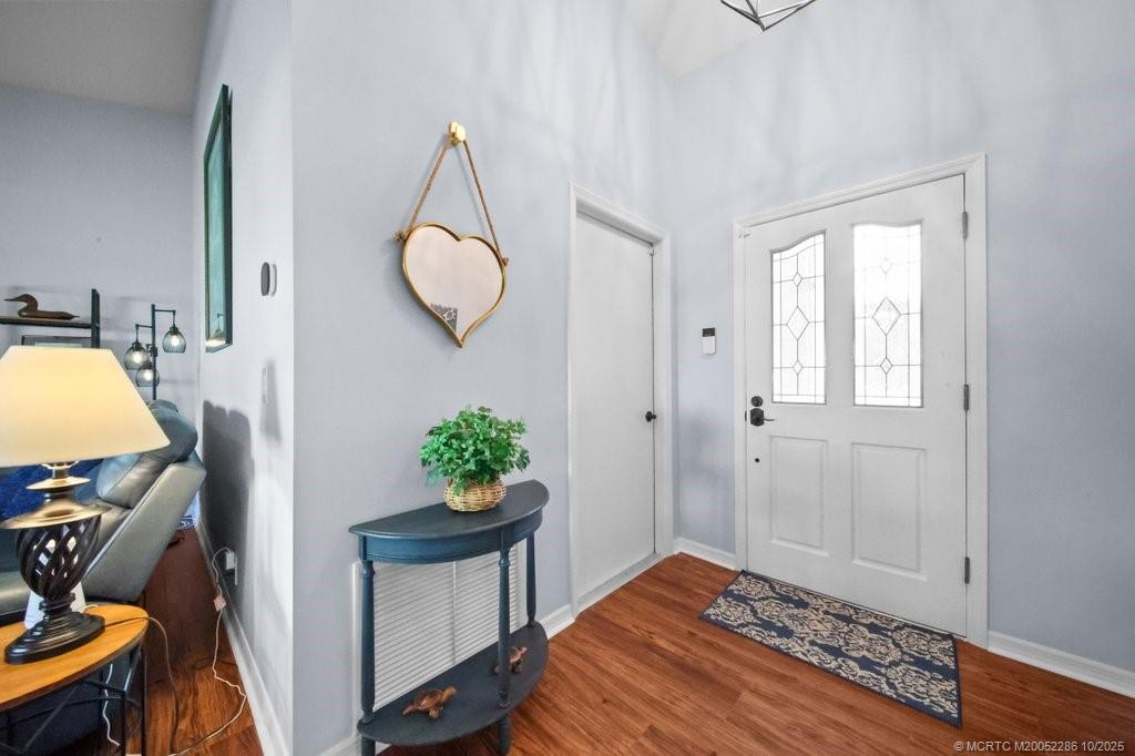 5157 Southeast Miles Grant Road Stuart, FL 34997 - Photo 3 of 32 a bedroom with a bed and a window