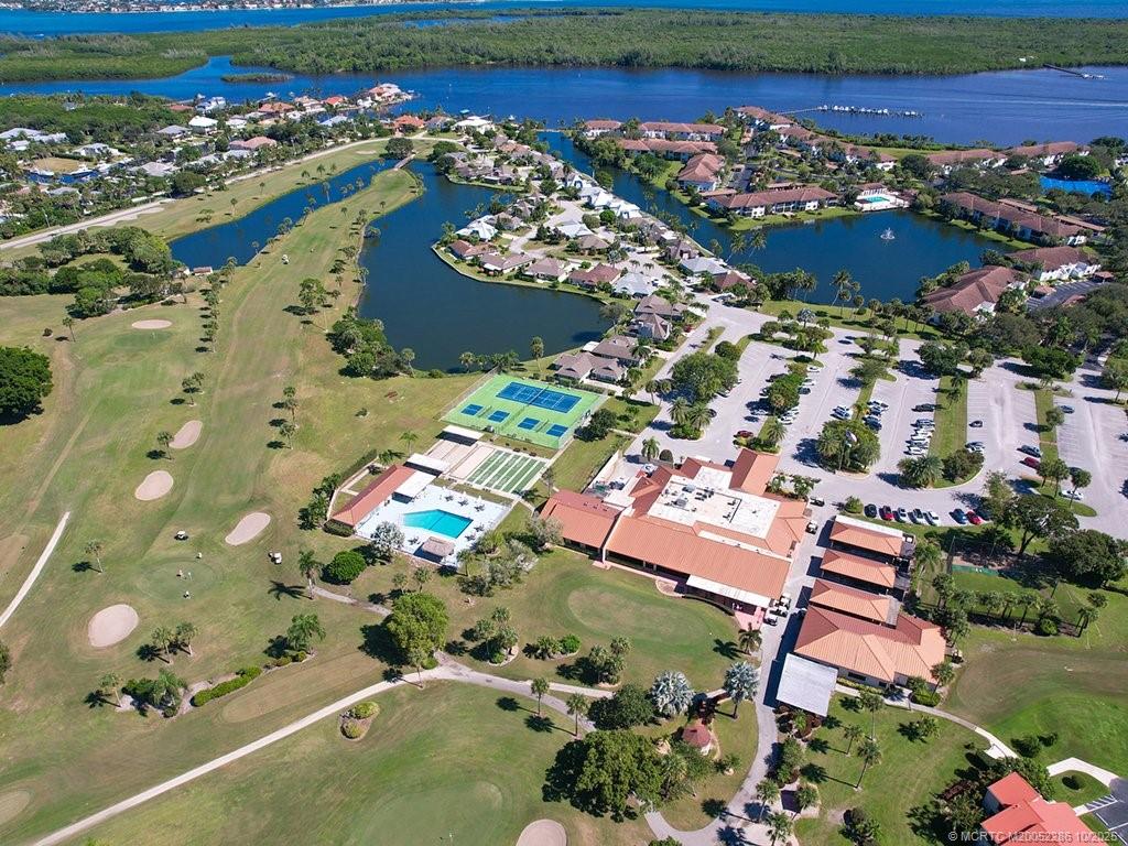 5157 Southeast Miles Grant Road Stuart, FL 34997 - Photo 31 of 32 an aerial view of residential houses with outdoor space