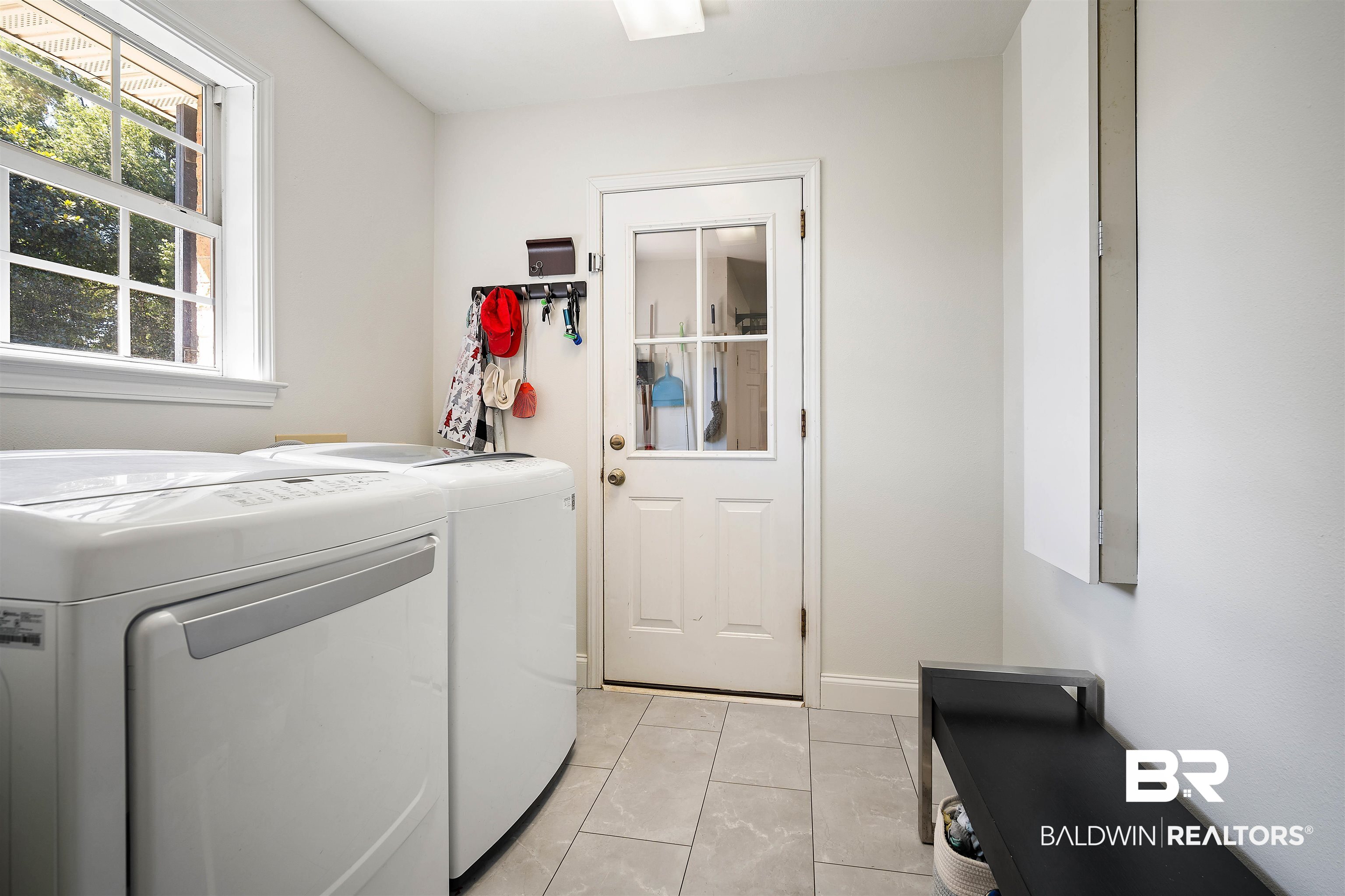808 Michigan Avenue Fairhope, AL 36532 - Photo 28 of 33 Laundry room featuring light tile patterned floors and washing machine and dryer