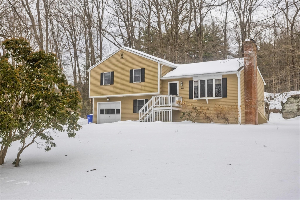 26 Falls Road Sunderland, MA 01375 - Photo 1 of 39 a front view of a house with a yard and garage