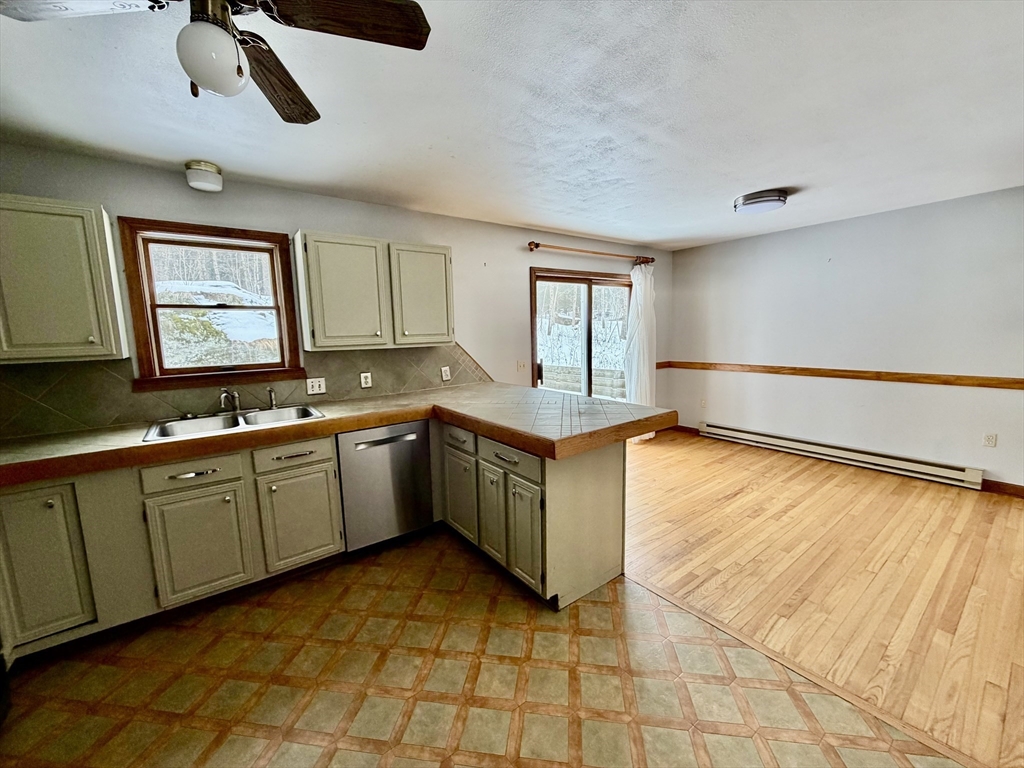 26 Falls Road Sunderland, MA 01375 - Photo 12 of 39 a kitchen with stainless steel appliances granite countertop a sink and cabinets