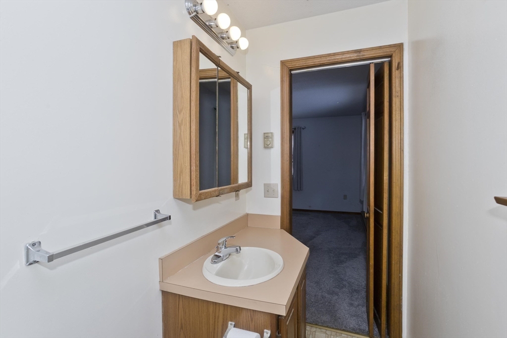 26 Falls Road Sunderland, MA 01375 - Photo 23 of 39 a bathroom with a sink and a mirror