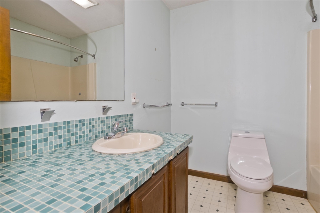 26 Falls Road Sunderland, MA 01375 - Photo 28 of 39 a bathroom with a sink a toilet and shower