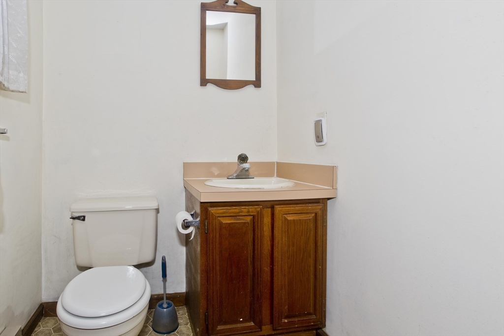 26 Falls Road Sunderland, MA 01375 - Photo 36 of 39 a bathroom with a toilet a sink and mirror