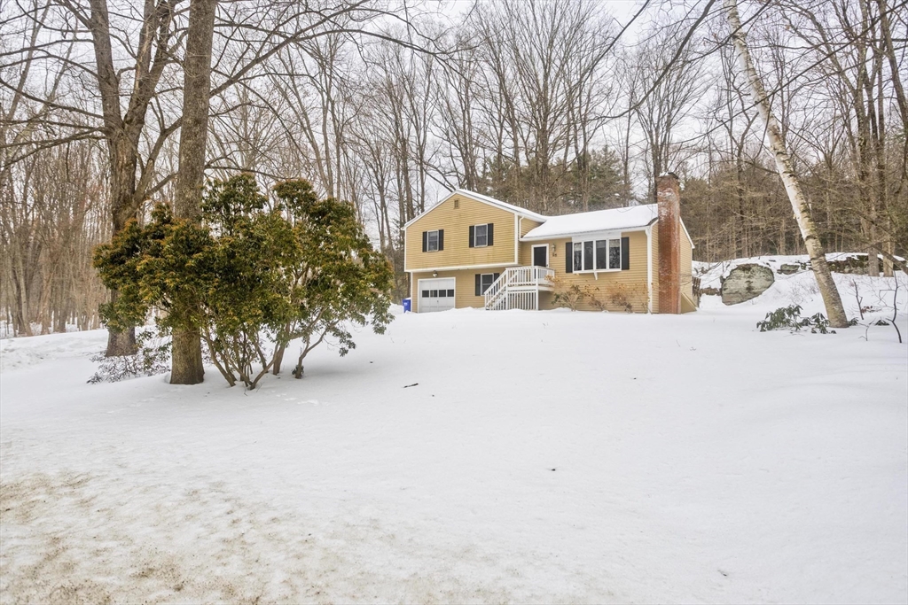 26 Falls Road Sunderland, MA 01375 - Photo 6 of 39 front view of a house with a yard covered in snow