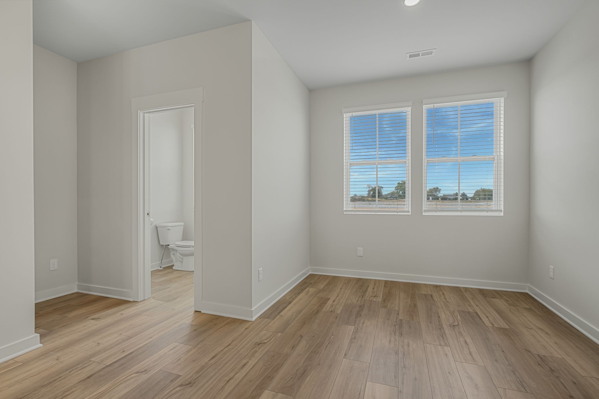 514 Hinton Street Lebanon, TN 37090 - Photo 10 of 58 an empty room with wooden floor and windows