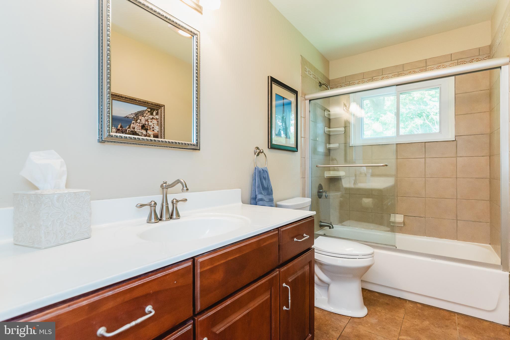 202 Burning Tree Road Lutherville-Timonium, MD 21093 - Photo 12 of 31 Full Bathroom with tile floor & tub surround