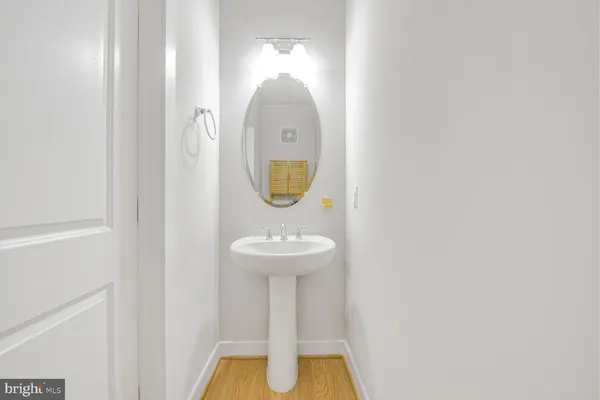 a bathroom with a granite countertop sink double and mirror