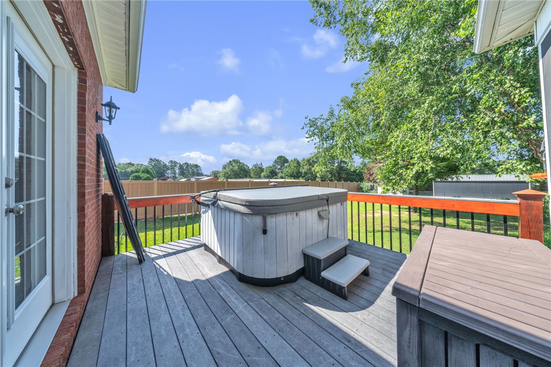 648 Mountain View Road Williamston, SC 29697 - Photo 31 of 42 A spacious wooden deck with a private spa offers a relaxing outdoor retreat.