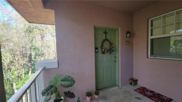 a view of a porch with furniture