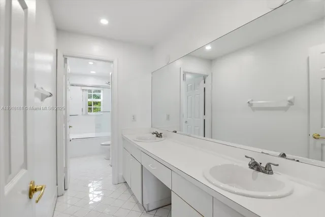 a bathroom with a shower a toilet and a sink