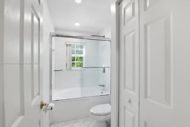 a front view of a house with garden and porch