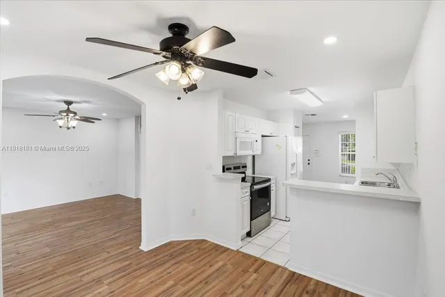 a view of a kitchen with a sink and dishwasher