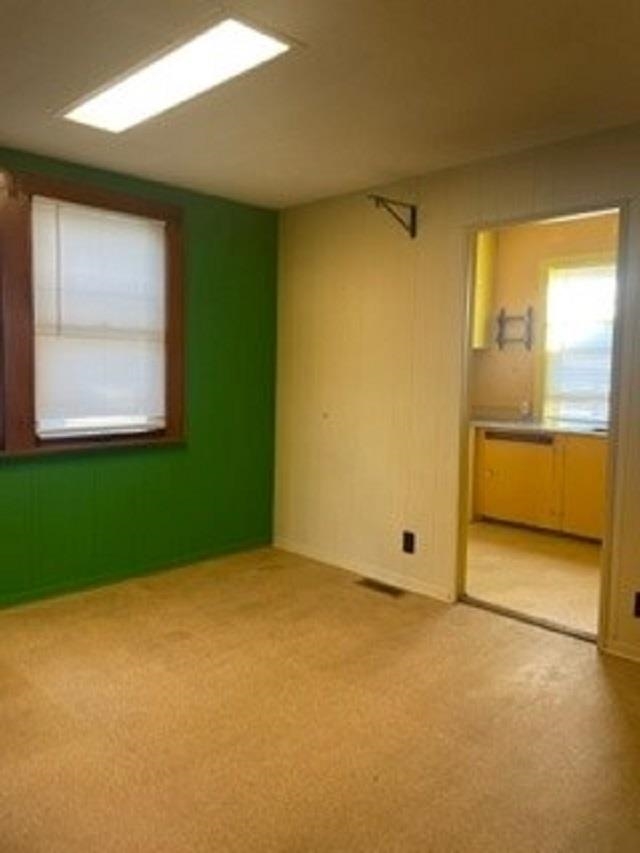 1646 South Topeka Avenue Wichita, KS 67211 - Photo 10 of 36 The doorway leads to the kitchen, which is bright yellow.