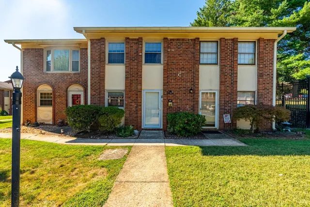 a view of a house with swimming pool and porch with furniture