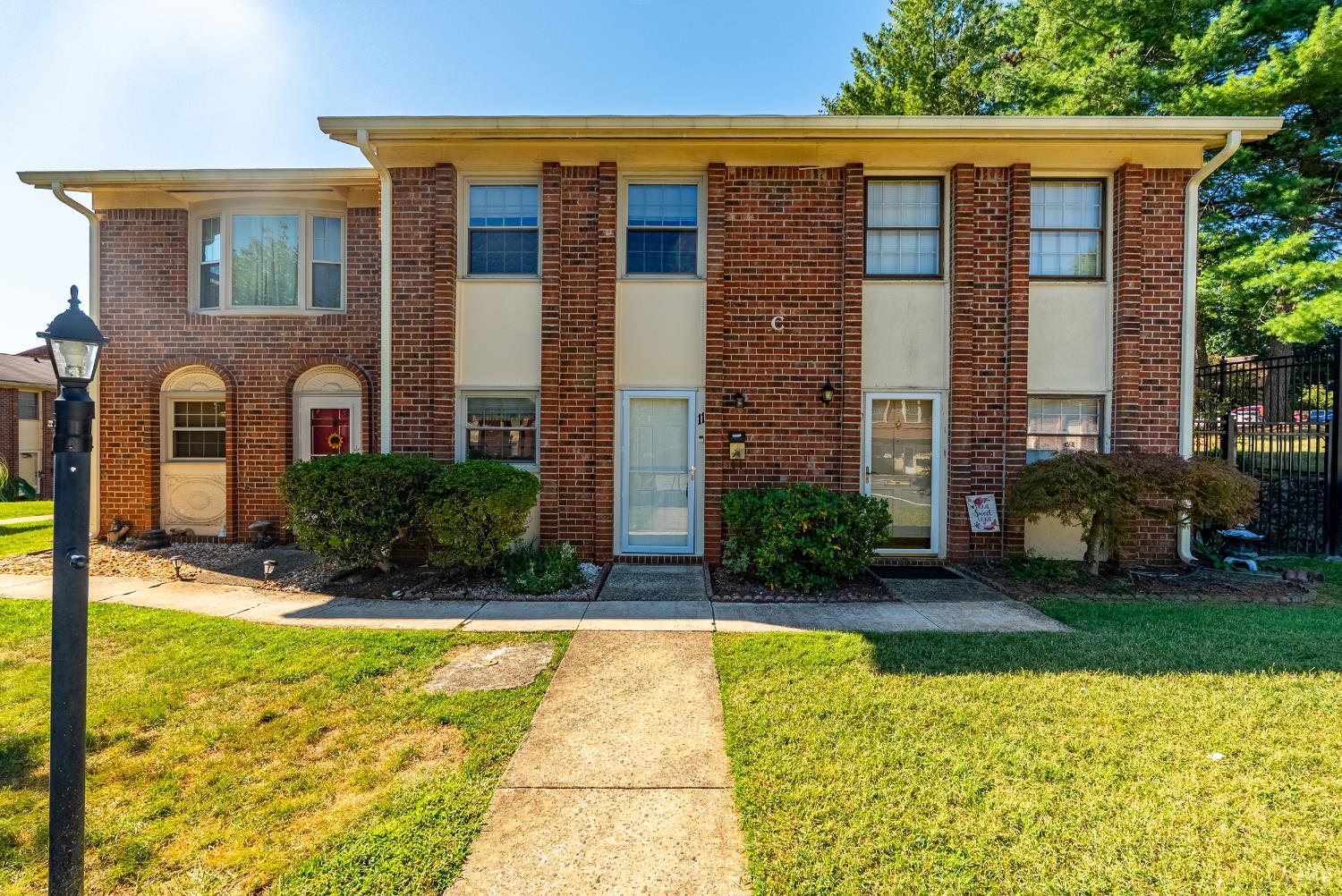 a view of a house with swimming pool and porch with furniture