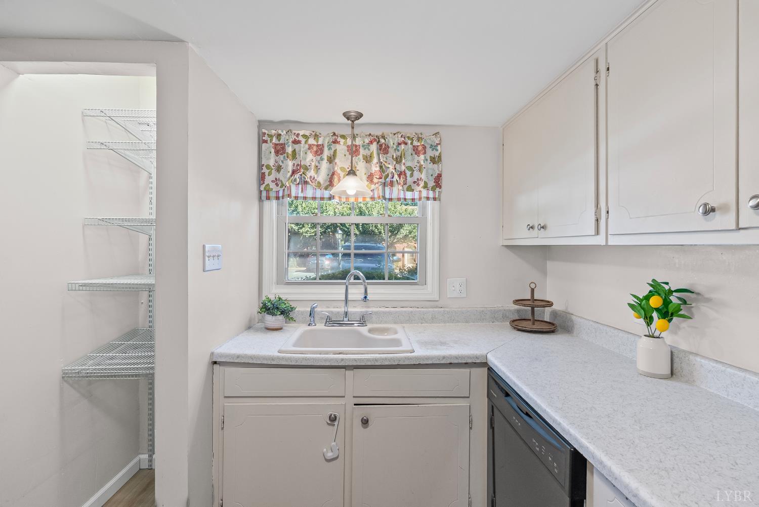 3101 Link Road, Unit 11 Lynchburg, VA 24503 - Photo 14 of 41 a kitchen with a sink a window and cabinets