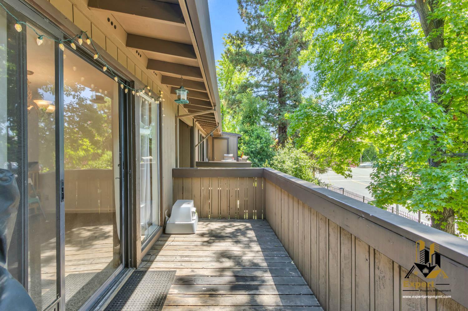 903 Fulton Avenue, Unit 406 Sacramento, CA 95825 - Photo 12 of 23 a view of a balcony with a tree