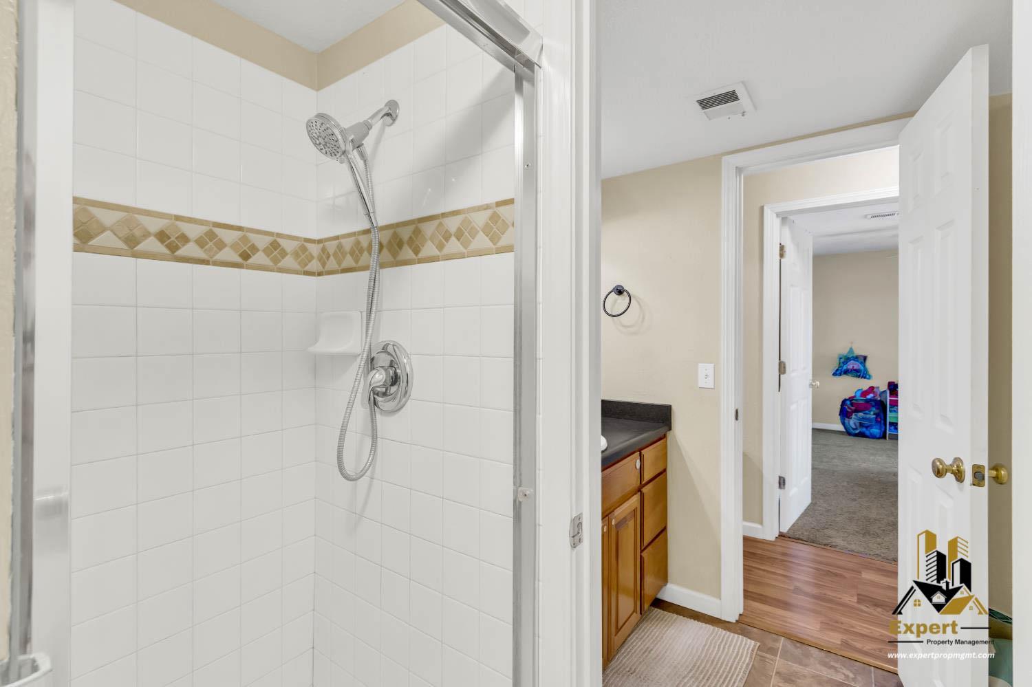 903 Fulton Avenue, Unit 406 Sacramento, CA 95825 - Photo 16 of 23 a bathroom with a shower