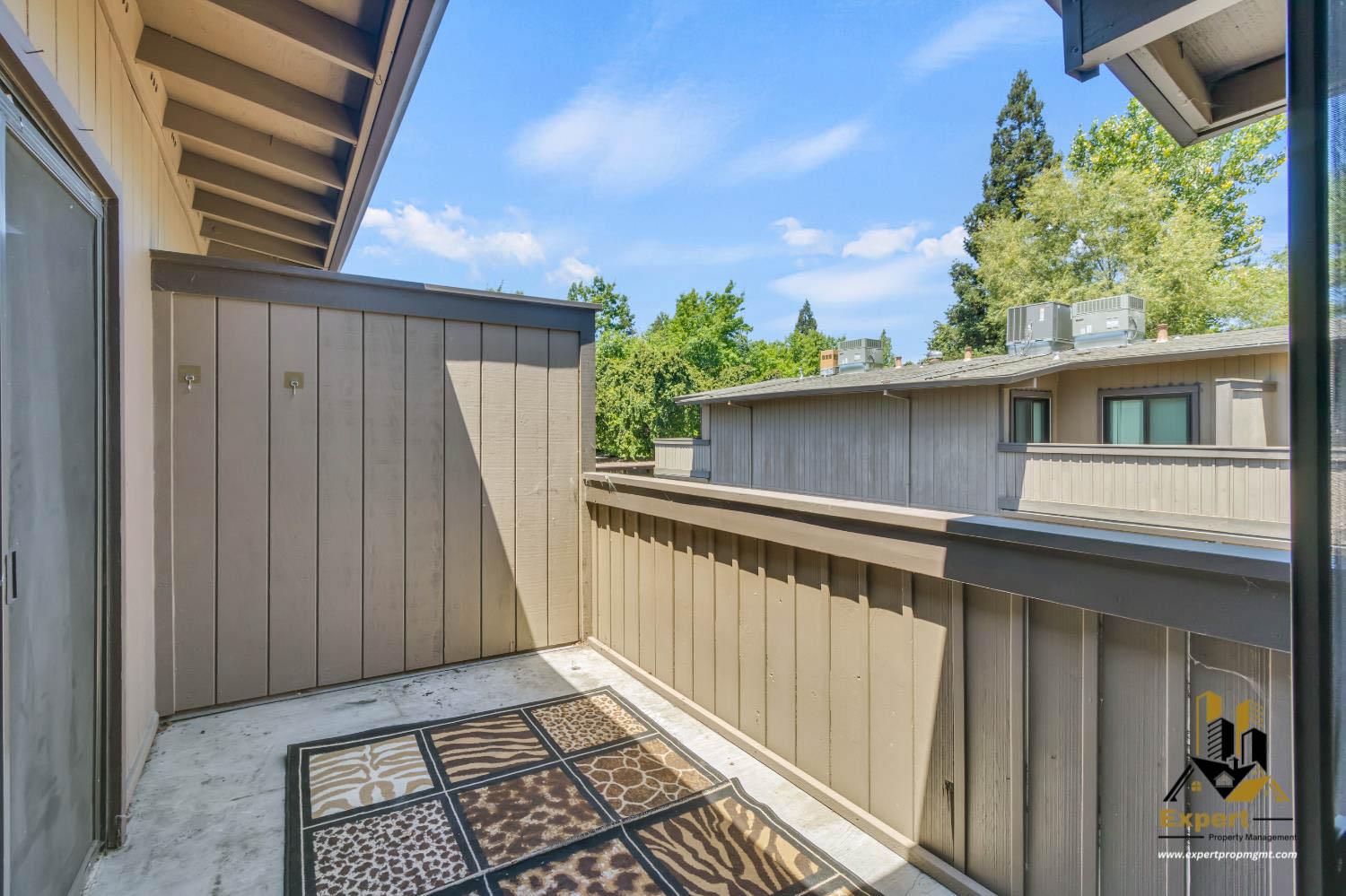 903 Fulton Avenue, Unit 406 Sacramento, CA 95825 - Photo 18 of 23 a balcony view with a garden