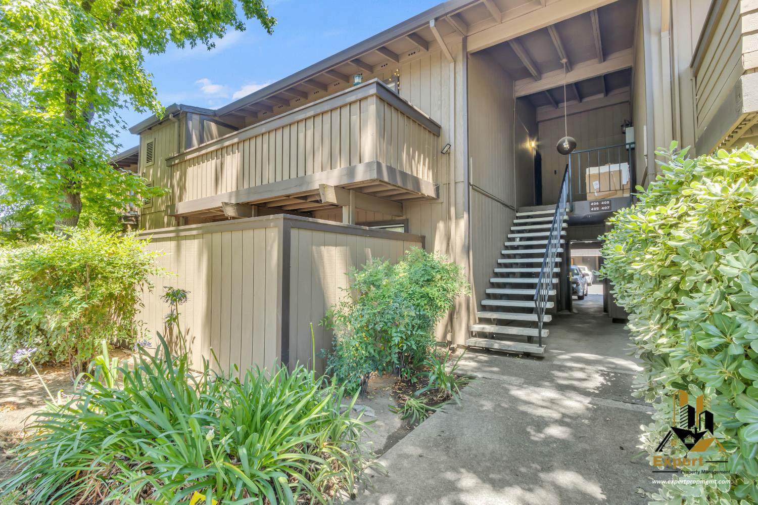 903 Fulton Avenue, Unit 406 Sacramento, CA 95825 - Photo 20 of 23 a front view of a house with a yard