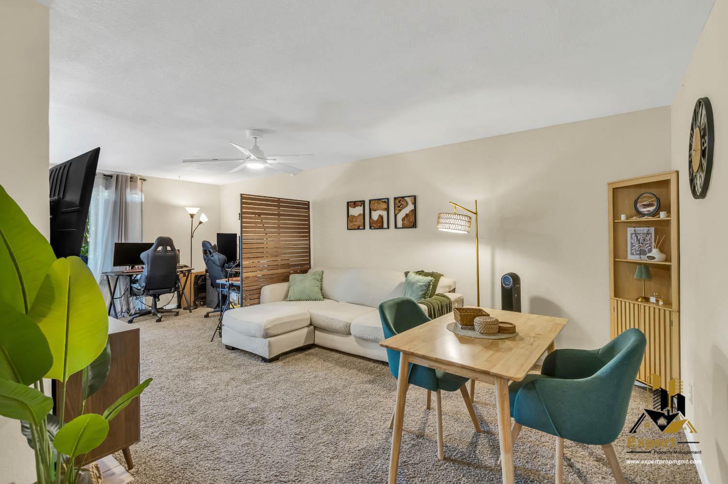 903 Fulton Avenue, Unit 406 Sacramento, CA 95825 - Photo 2 of 23 a living room with furniture a rug and a table