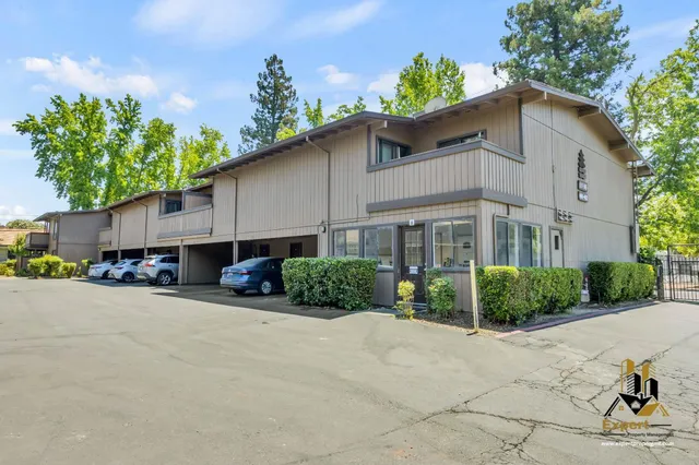 an aerial view of a house with a swimming pool