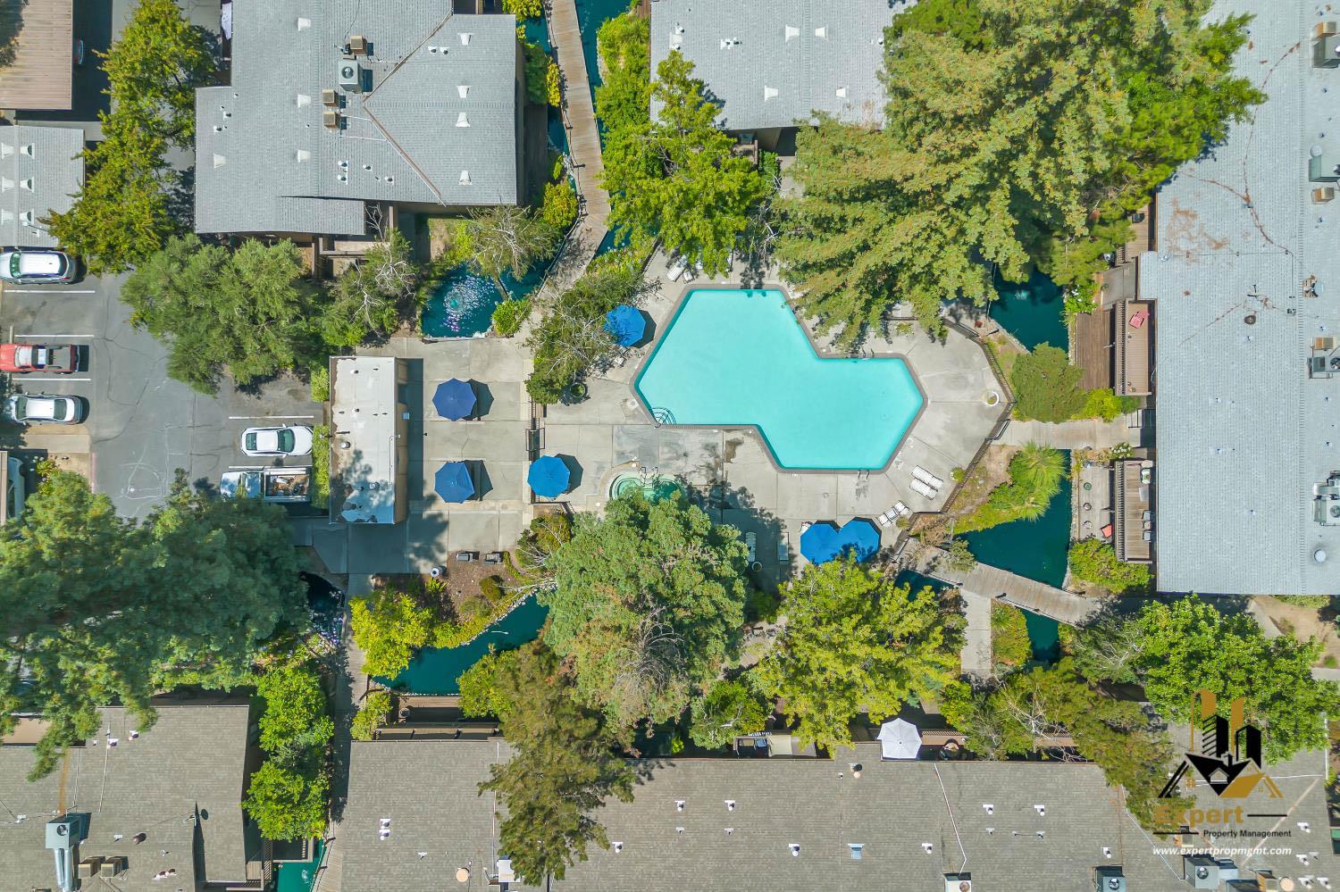 903 Fulton Avenue, Unit 406 Sacramento, CA 95825 - Photo 22 of 23 an aerial view of a house with a swimming pool
