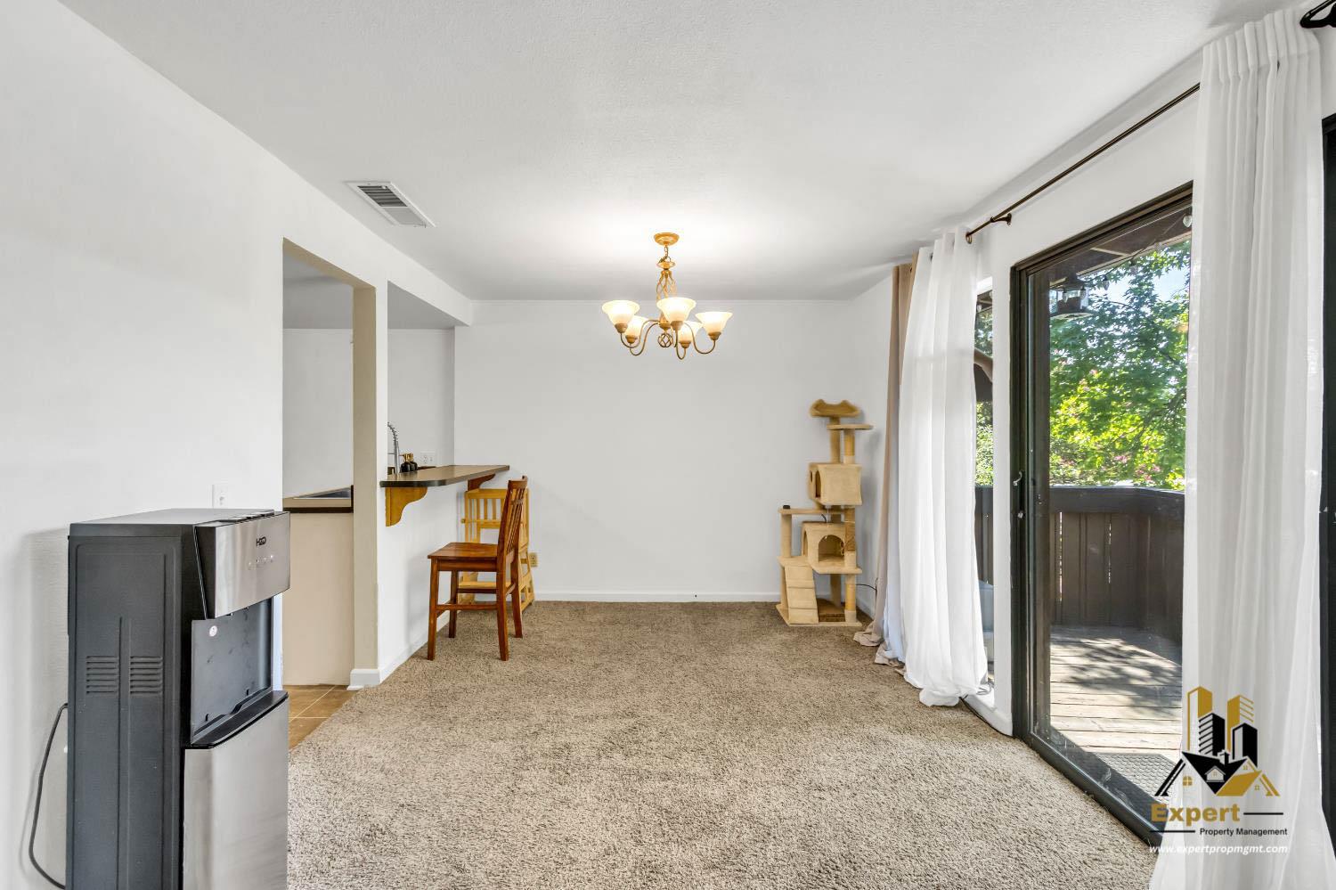903 Fulton Avenue, Unit 406 Sacramento, CA 95825 - Photo 7 of 23 a view of a livingroom with furniture and a window