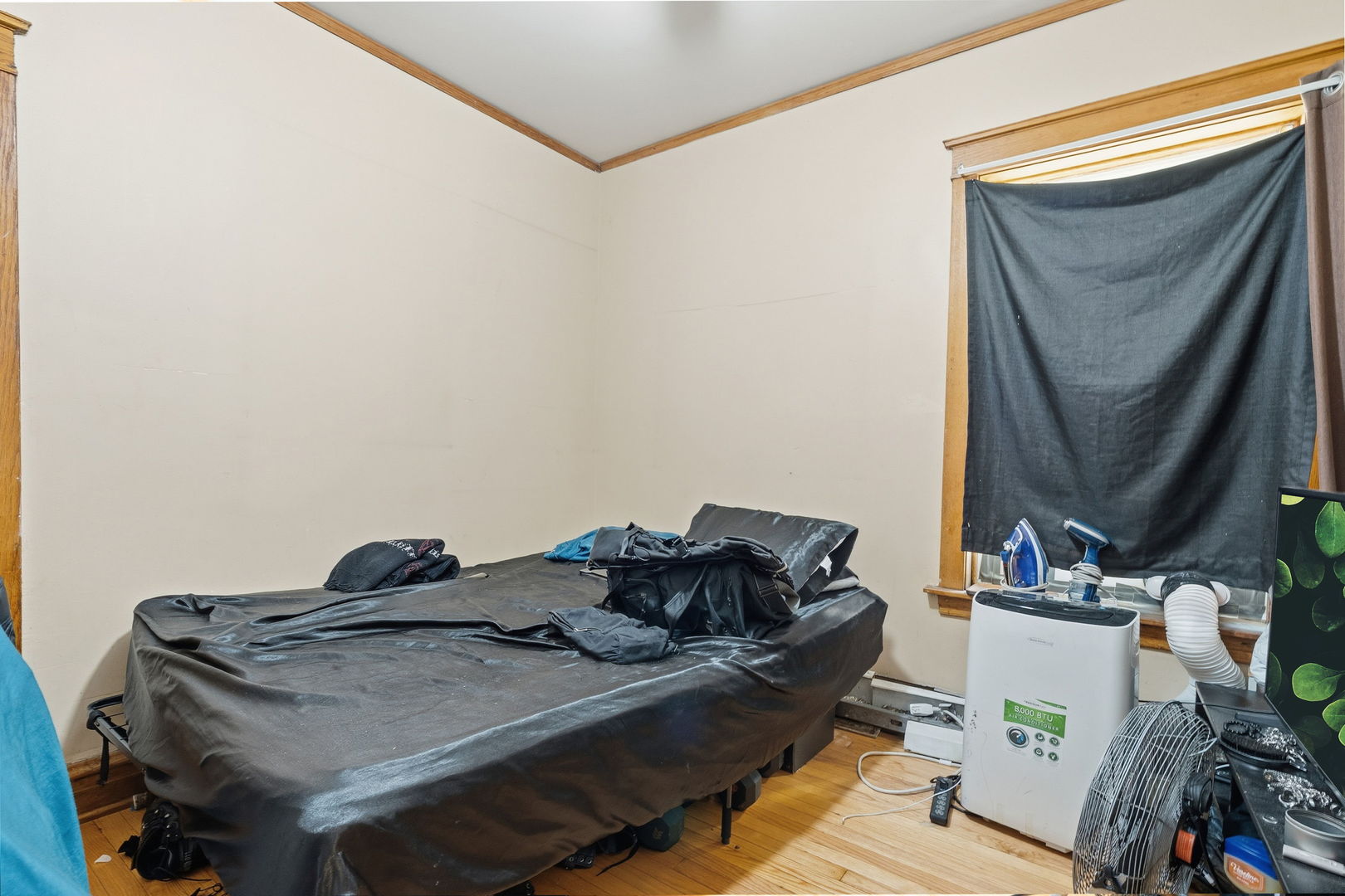 4016 West Crystal Street Chicago, IL 60651 - Photo 11 of 17 a living room with furniture and a mirror