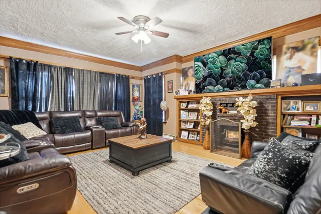 a living room with furniture a rug and a chandelier