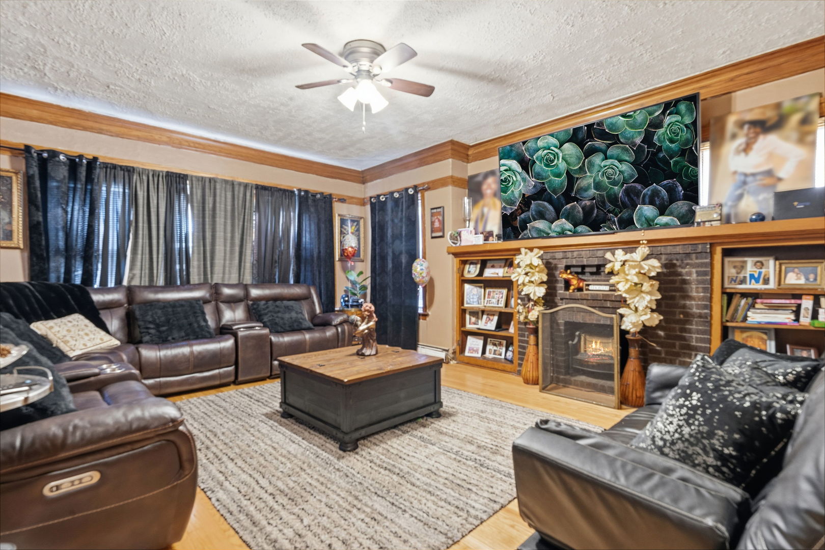 4016 West Crystal Street Chicago, IL 60651 - Photo 3 of 17 a living room with furniture a rug and a chandelier