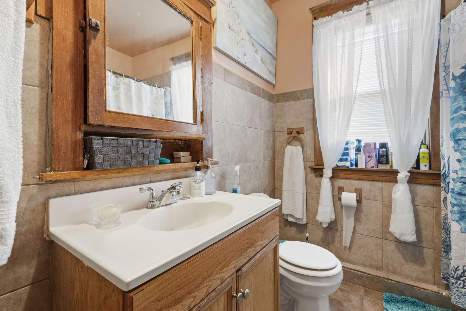 4016 West Crystal Street Chicago, IL 60651 - Photo 7 of 17 a bathroom with a sink toilet and shower