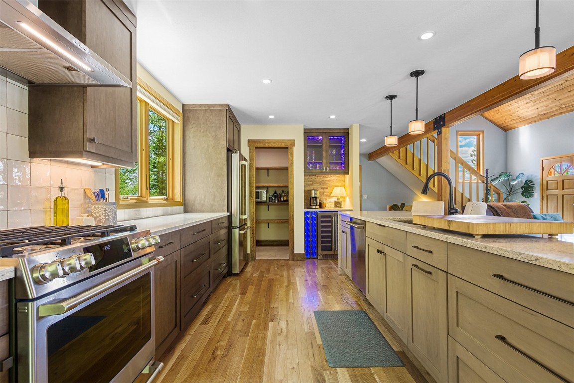 87 Spring Beauty Drive Silverthorne, CO 80498 - Photo 11 of 36 a kitchen with stainless steel appliances granite countertop a stove and a sink