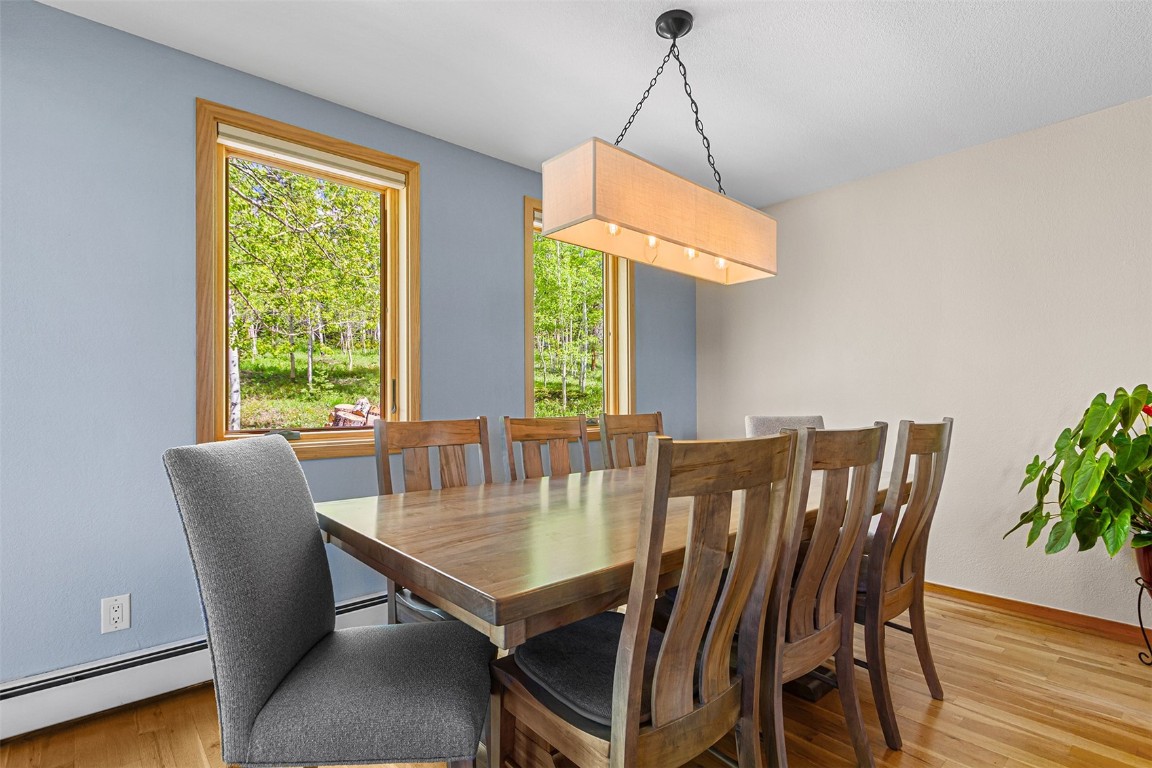 87 Spring Beauty Drive Silverthorne, CO 80498 - Photo 16 of 36 a view of a dining room with furniture window and outside view