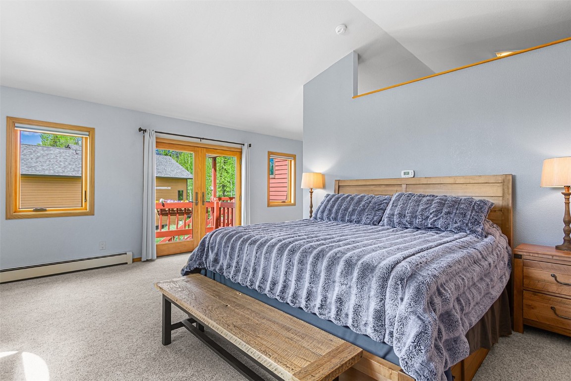 87 Spring Beauty Drive Silverthorne, CO 80498 - Photo 21 of 36 a bed sitting in a bedroom next to a window